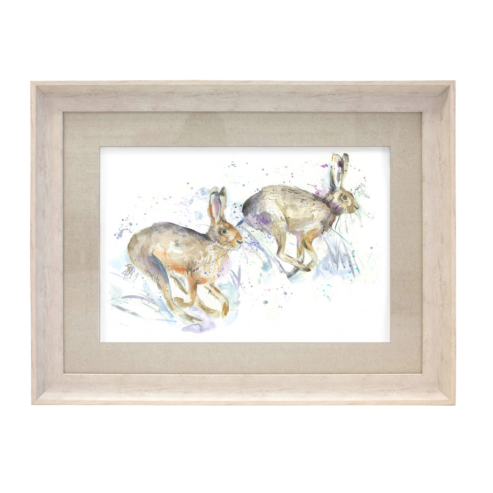 Hurtling Hares Framed Print