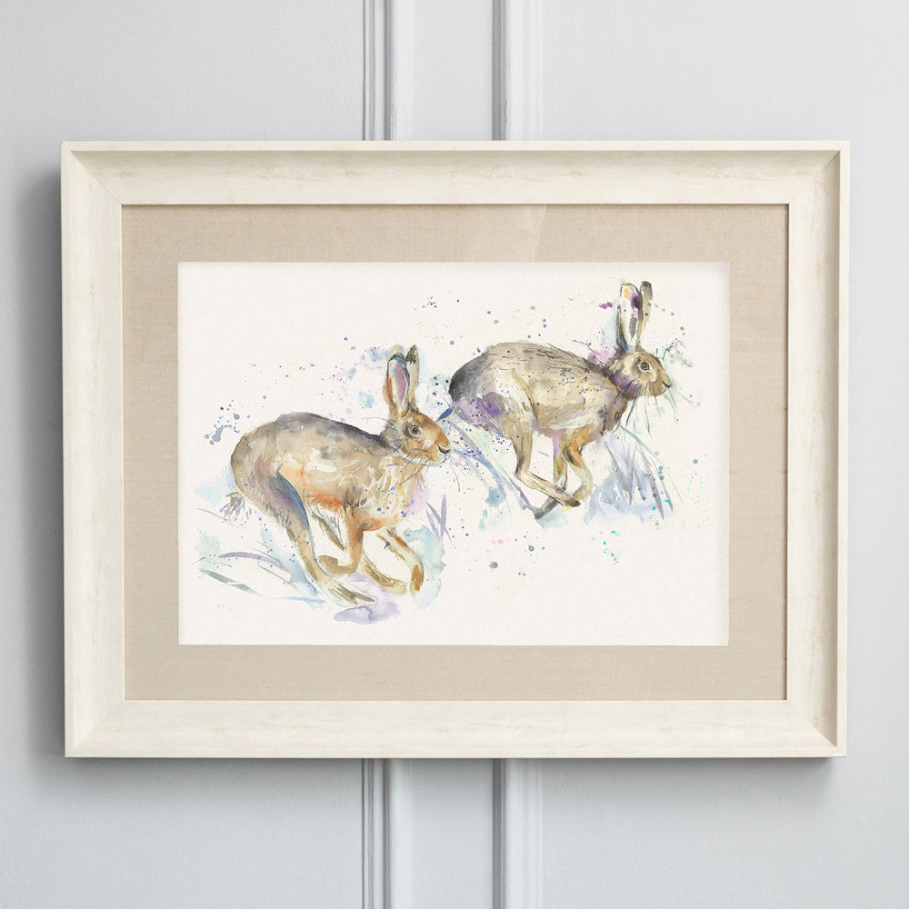 Hurtling Hares Framed Print