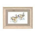 Hurtling Hares Framed Print