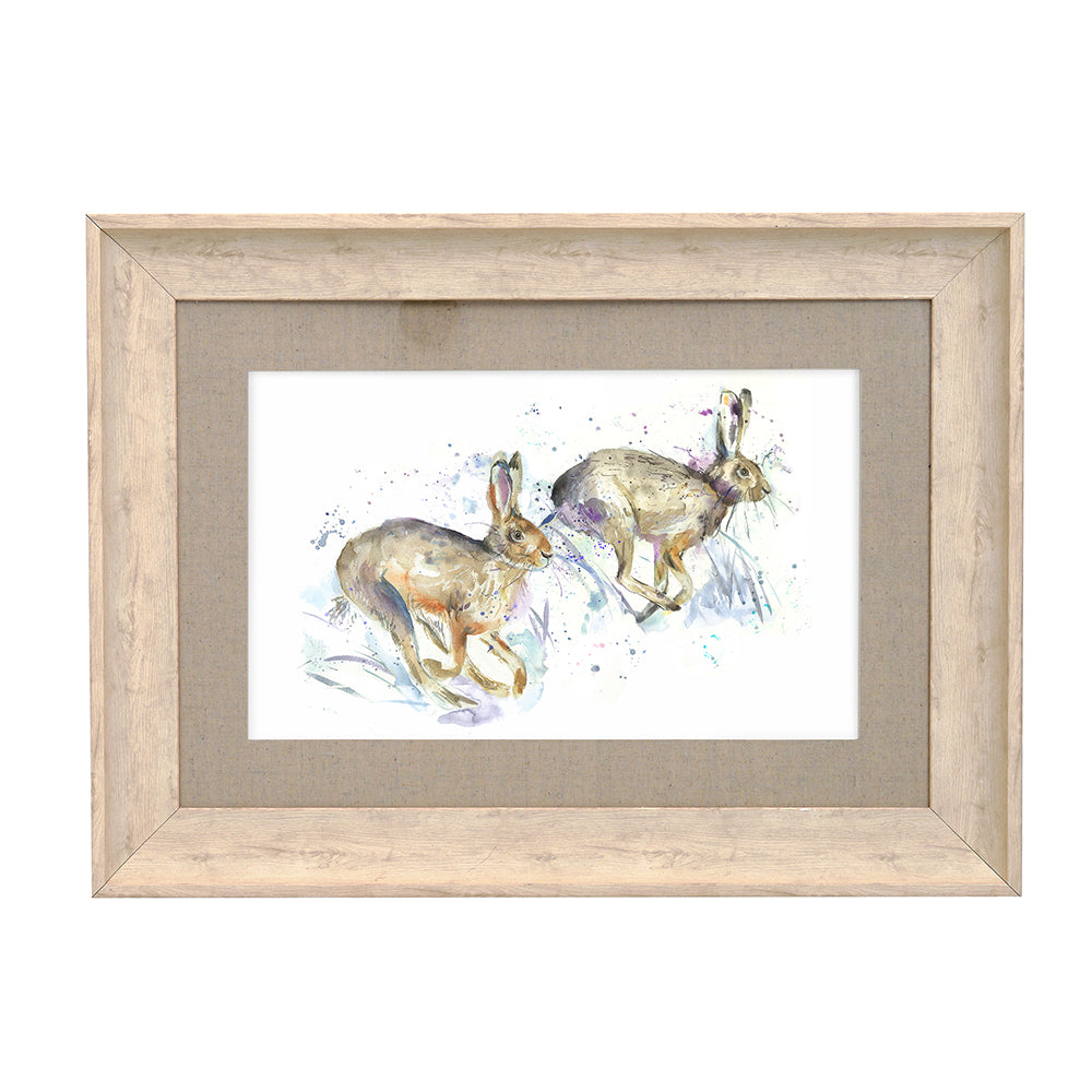 Hurtling Hares Framed Print